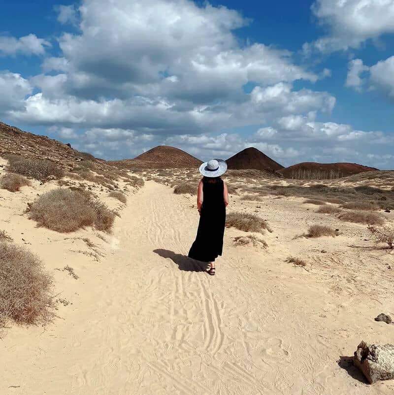 walking into the distance amongst the sand dunes