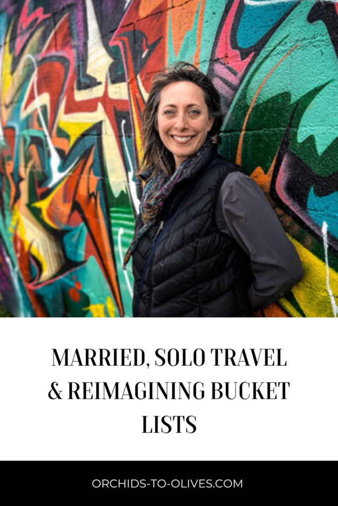 Pinterest vertical pin with an image of Tracy from Travel Bug Tonic and the title married, solo travel and reimagining bucket lists underneath 
