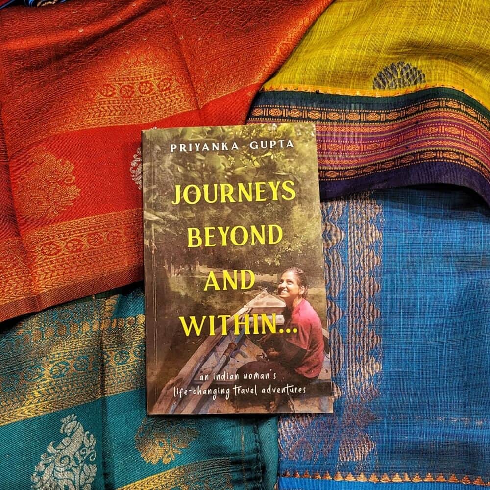 Priyanka's book Journey from beyond and within on colourful Indian fabric