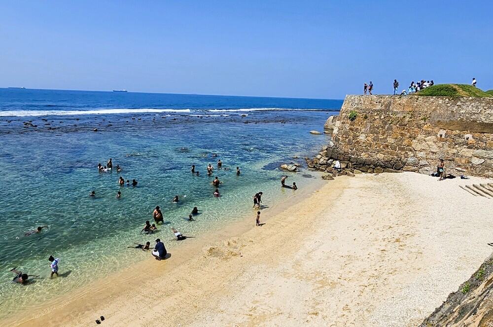 a tint bay in Galle Fort's walls, clear blue serene ocean 
