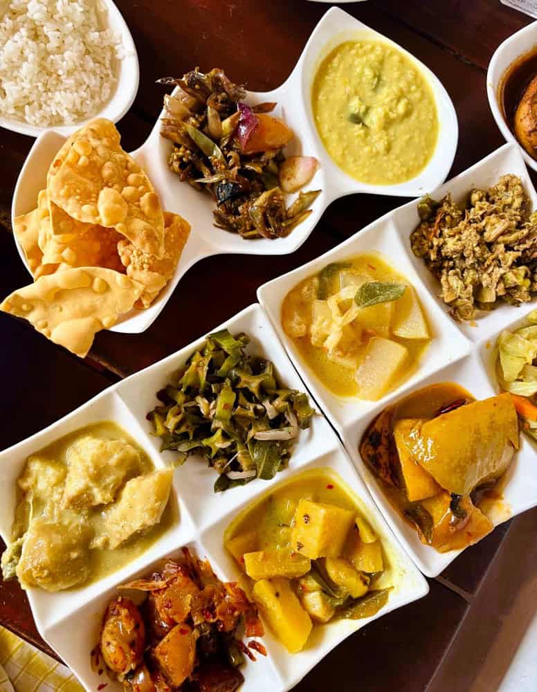 10 small plates of rice and curry at Lucky Fort Restaurant in Galle