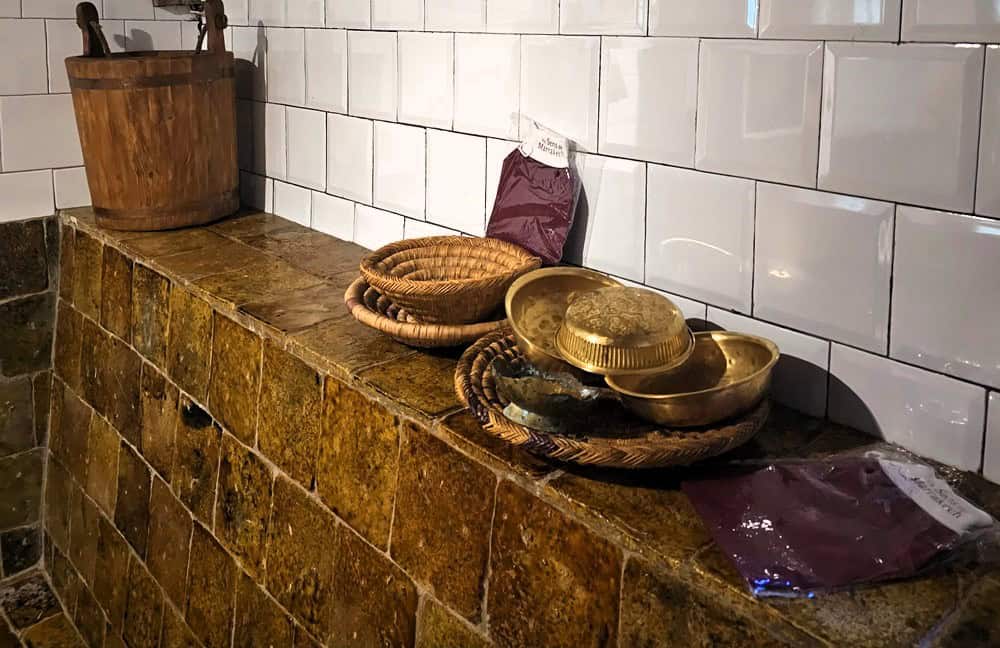 a shelf showing bowls and scrubs used during a hammam - ideal for midlife women with chronic illness 