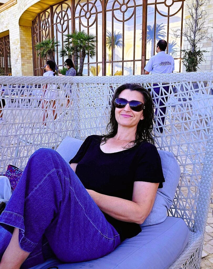 myself lounging in a wicker chair at Mövenpick Resort & Marine Spa 