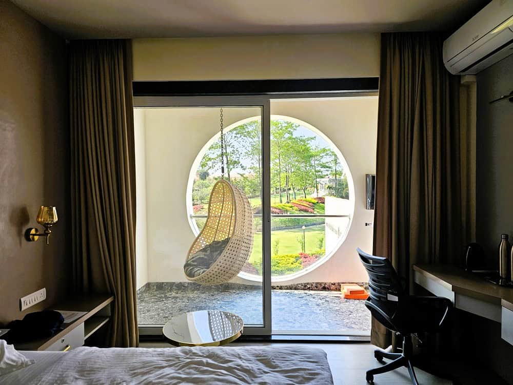 view of balcony with swing chair at   at Nirvana Naturopathy Retreat & Hospital 