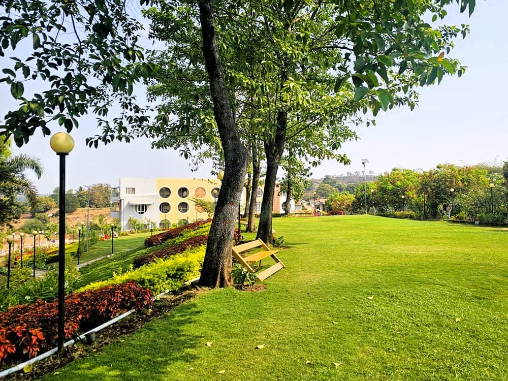 manicured lawns and flower beds with plenty of seating