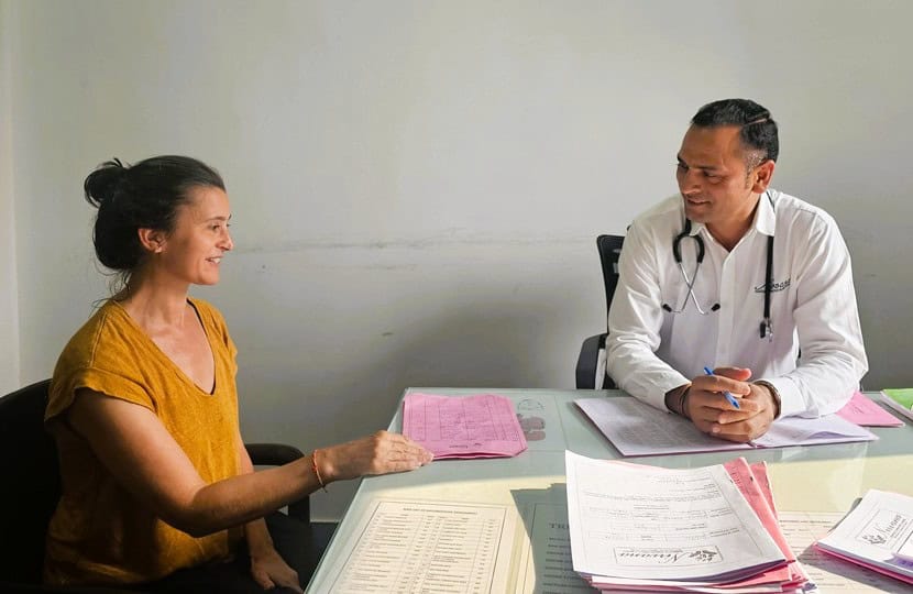 Jenny having a discussion with doctor at  Nirvana Naturopathy Retreat