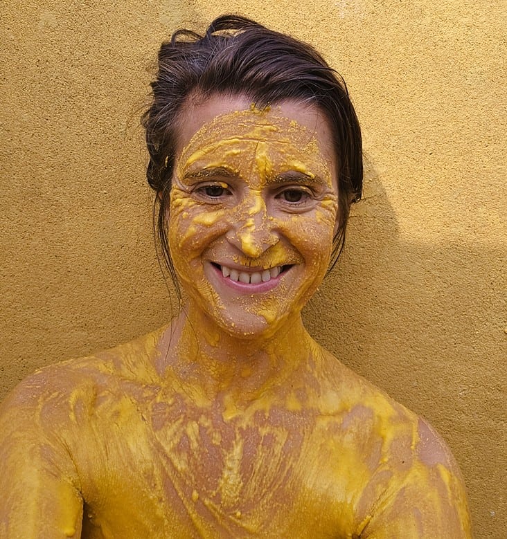 Jenny covered in turmeric at Nirvana Naturopathy Retreat