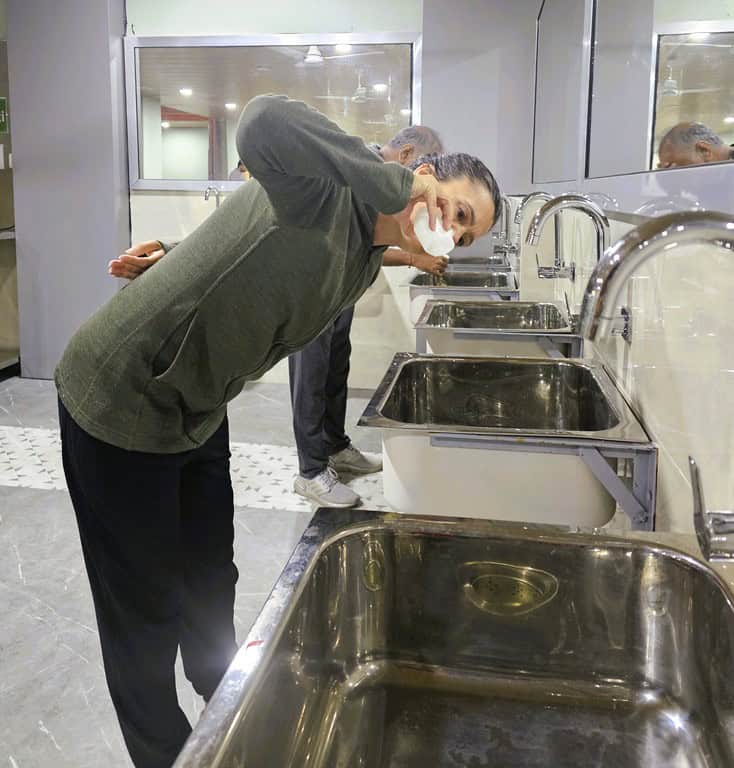 Myself putting water up my nose using a traditional neti pot