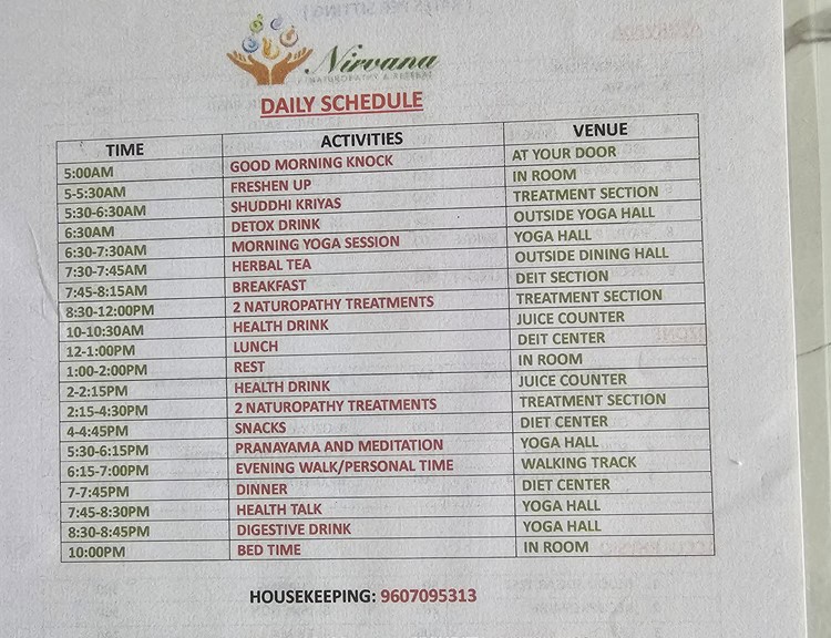 A photo of the daily schedule at Nirvana Naturopathy Retreat