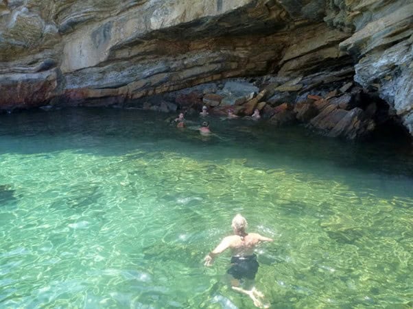 Retreats for midlife women with chronic health conditions in Greece - bathing in spring waters