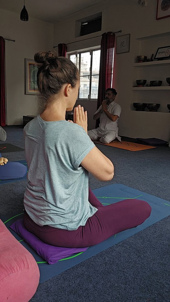 Myself with prayer position at Yoganga Healing Retreat, Rishikesh, India 