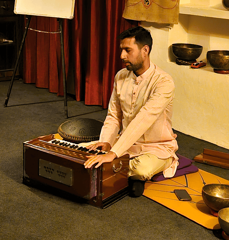 Rohit playing the harmonium at at Yoganga Healing Retreat, Rishikesh, India  