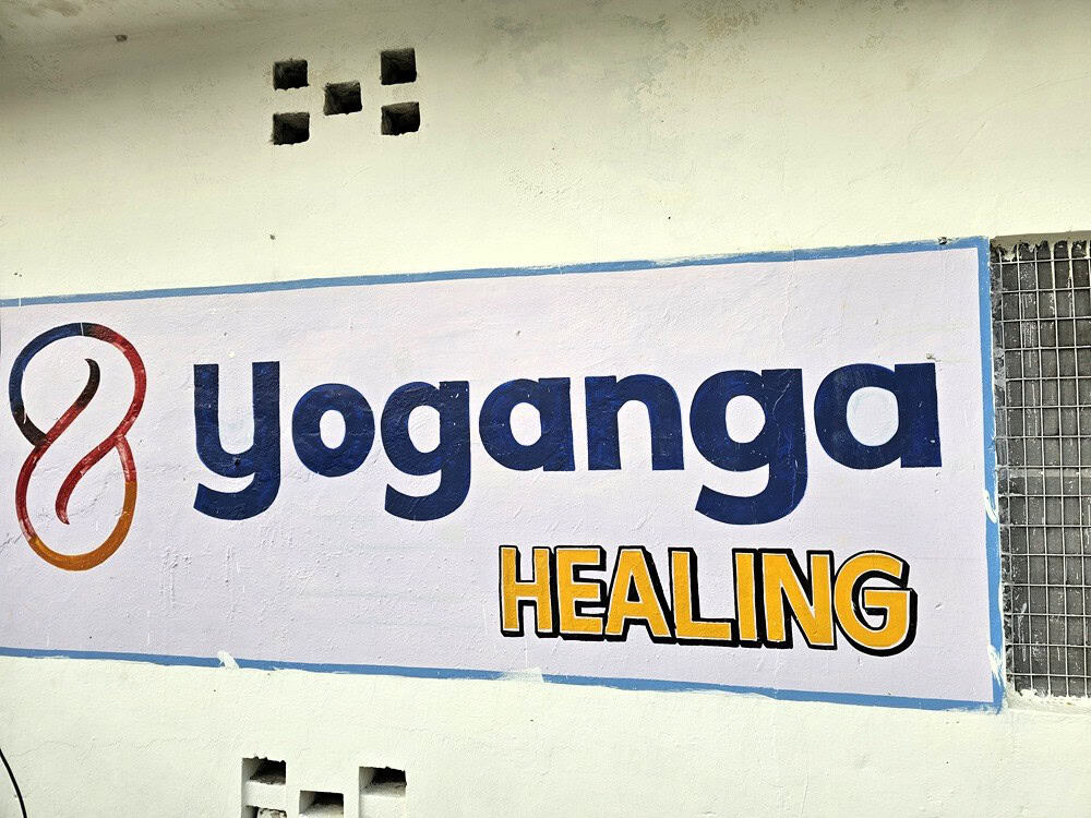 Image of Yoganga Healing logo on the wall