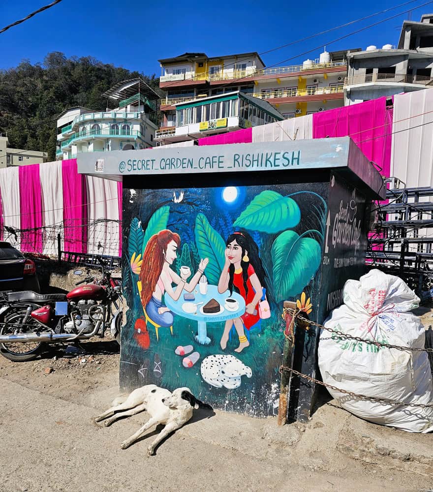 a mural showing two women at a cafe talking 