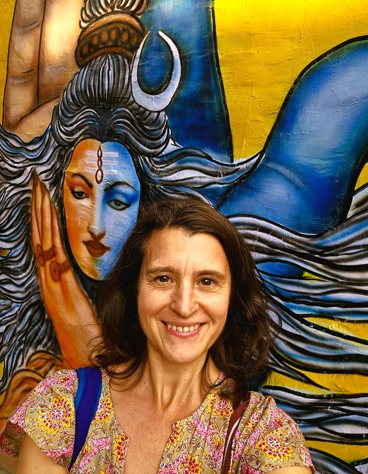 an image of myself in front of a mural - 52 and happy in Rishikesh 