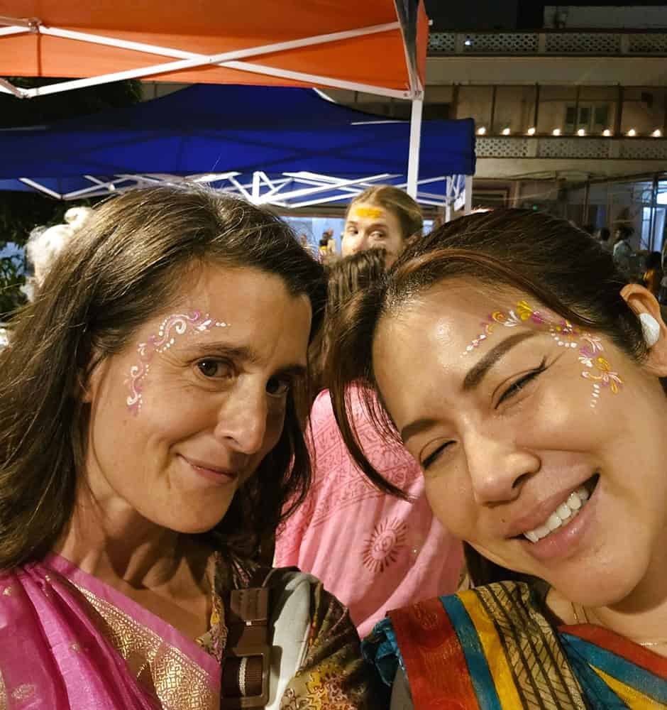 two midlife women aged 52 at Kirtan festival in Rishikesh 