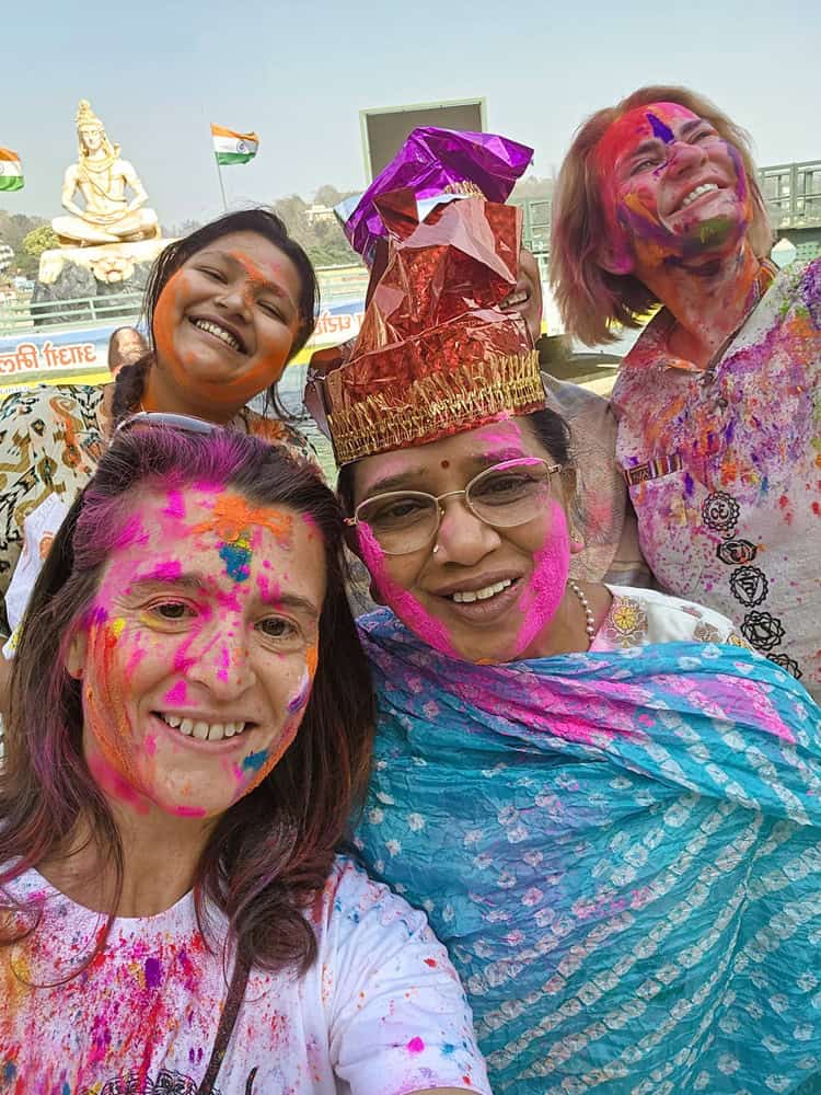 myself a midlife woman with FND celebrating Holi in Rishikesh 