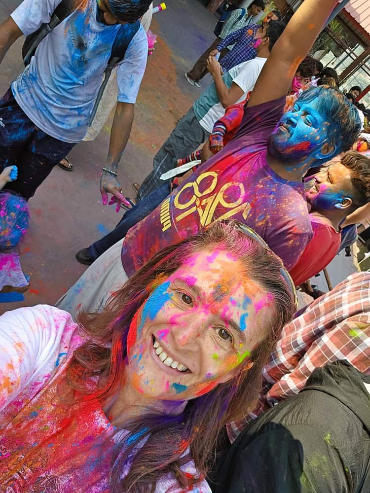 myself a midlife woman with FND celebrating Holi in Rishikesh 
