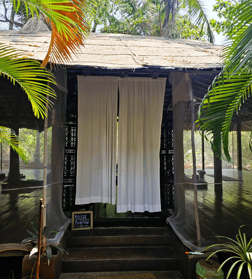 opening to the yoga shala Ashiyana Yoga Retreat, Goa, India with white curtains 