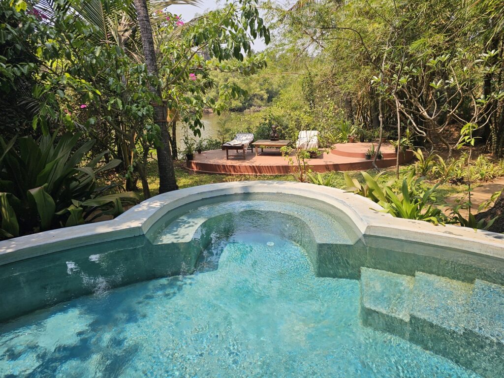 a pool overlooking the river at Ashiyana Yoga Retreat in Goa, India 