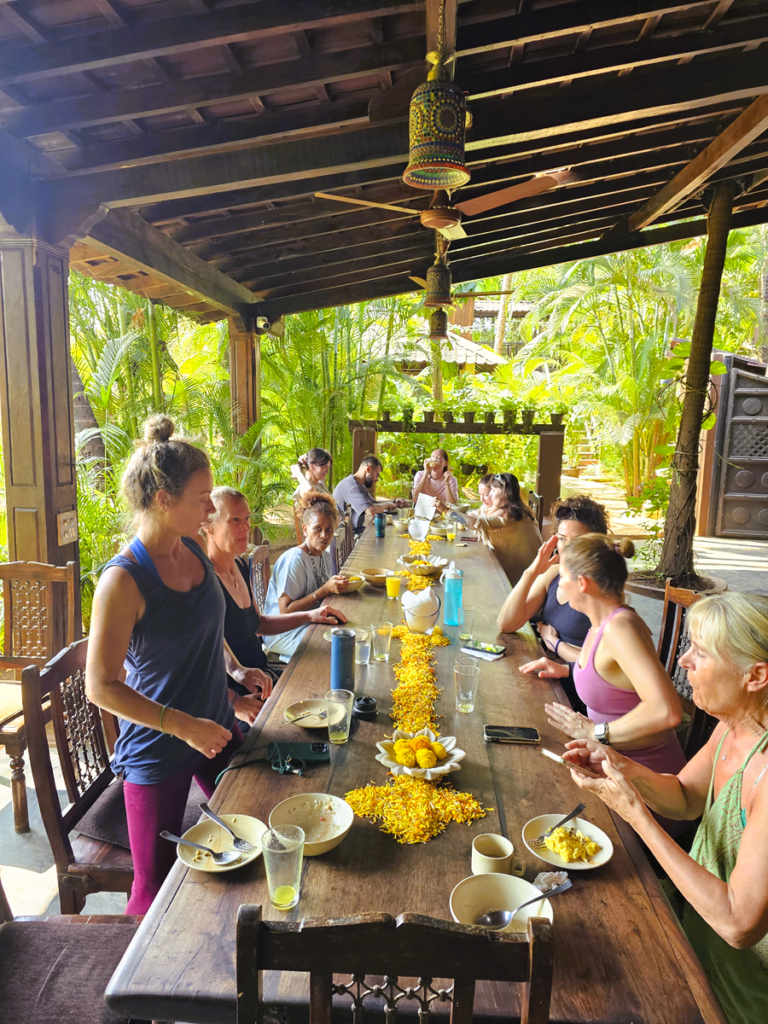 image of people at the dining table Ashiyana Yoga Retreat, Goa, India 