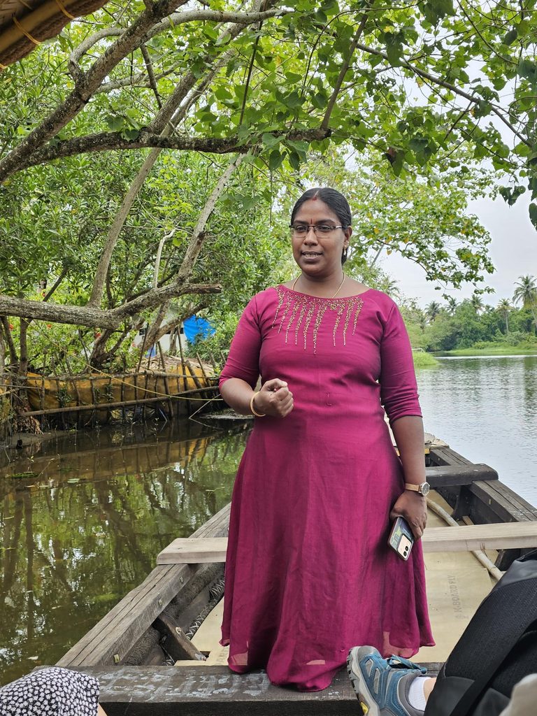 female guide on eco backwaters cruise in Kerala