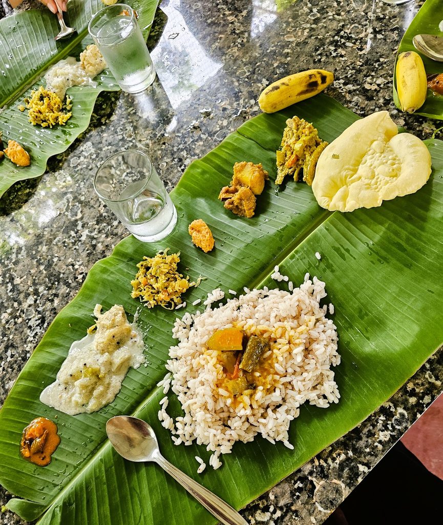 banana leaf with different types of Keralan curries, eaten after eco backwaters cruise in Kerala