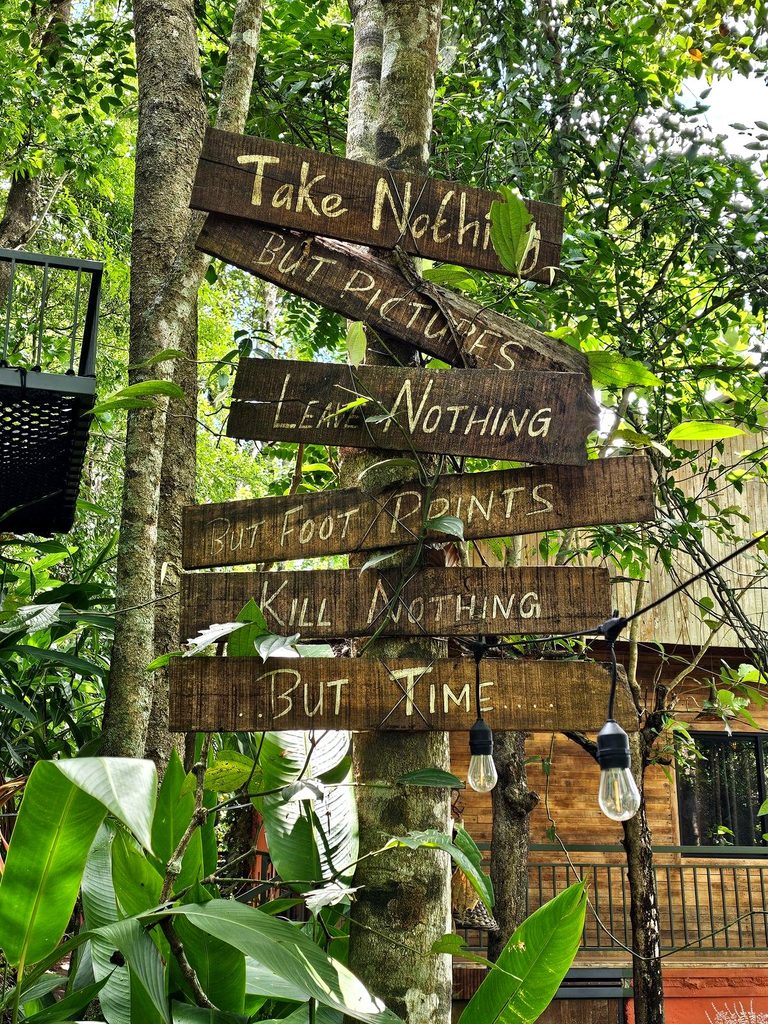 A sign on a reading Take Nothing, But Pictires, Leave Nothing, But footprints, kill nothing but time