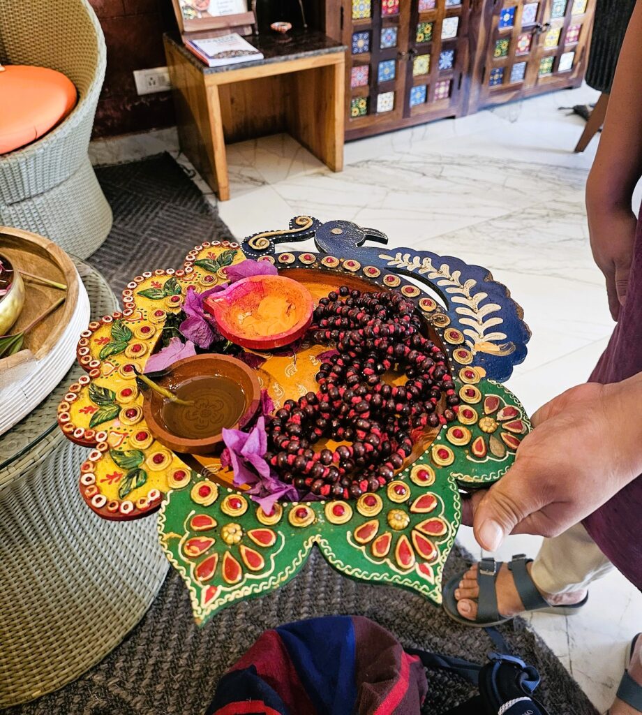 a colourful bowl with colours for creating a bhindi and mala prayer beads