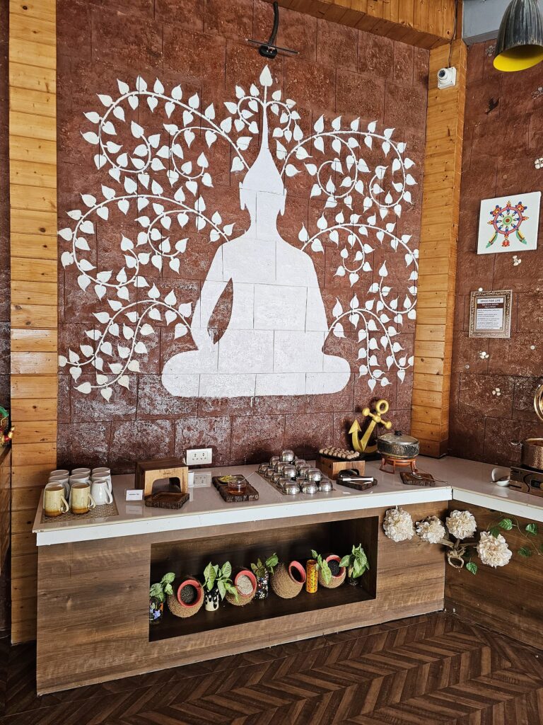 image of buddha on the wall with food on front of it 