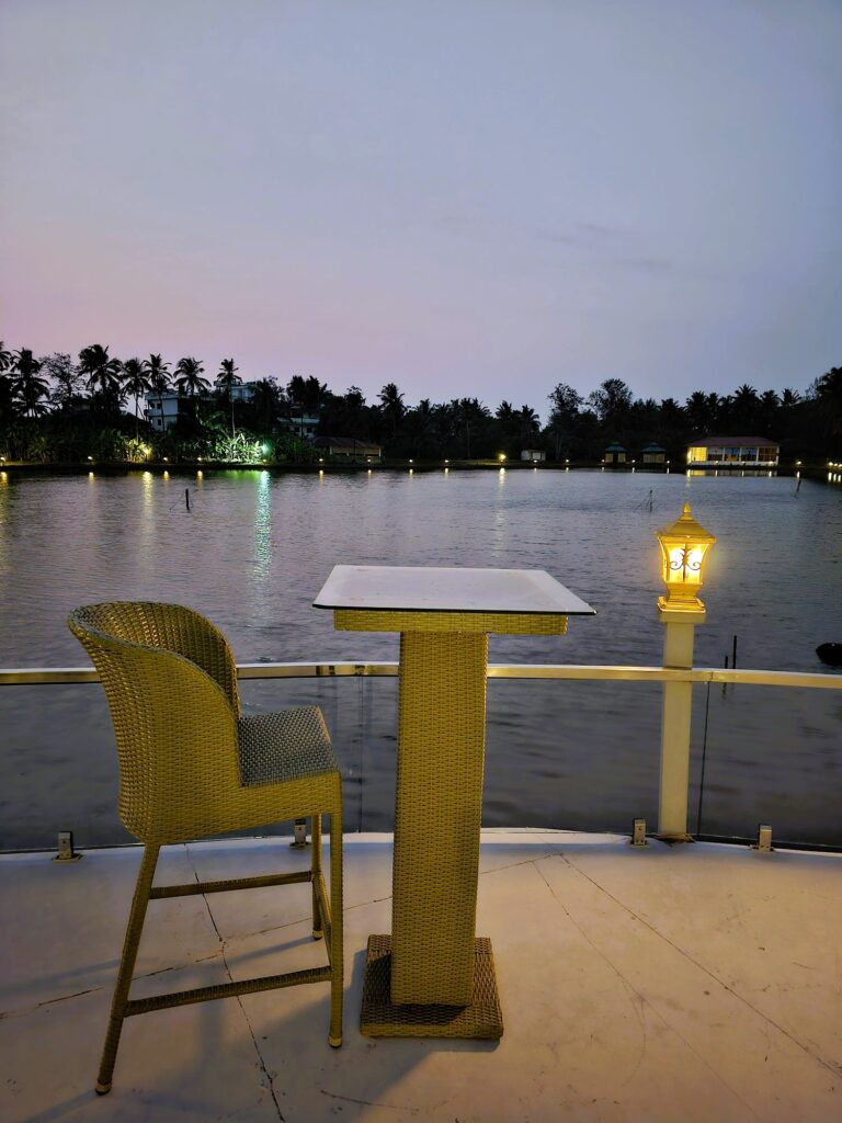 a single table and chair overlooking the lake 