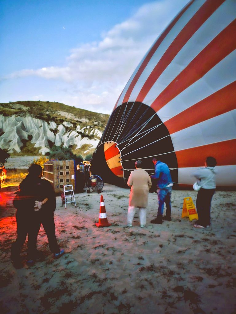 the hot air balloon on the ground before being filled with air
