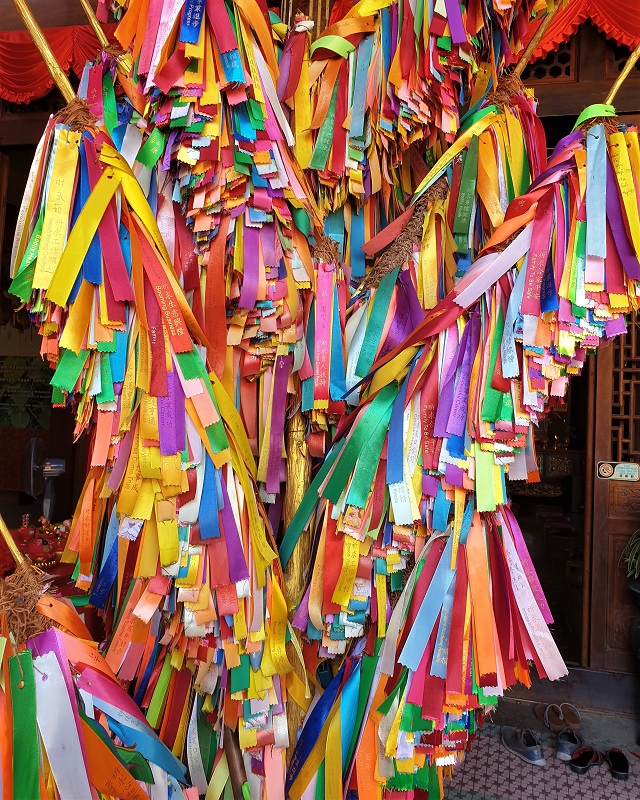 A brightly coloured ribbon wish tree.