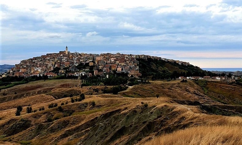 A view to the hilltop town of Montenero Di Bisaccia, with the ocean in the distance