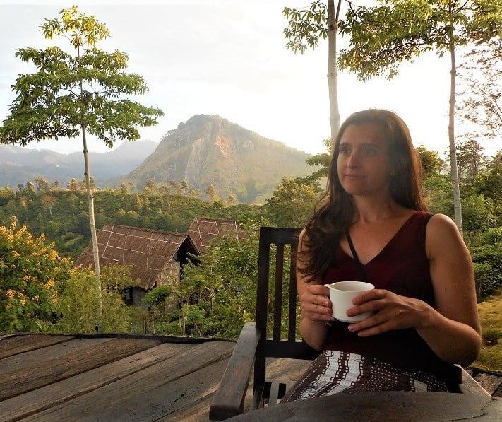 Myself drinking tea with mountains in the distance 