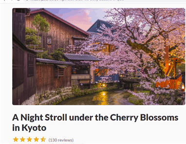 An image of the wooden houses in Kyoto running by a stream and a cherry blossom overhanging the stream from the Heygo website