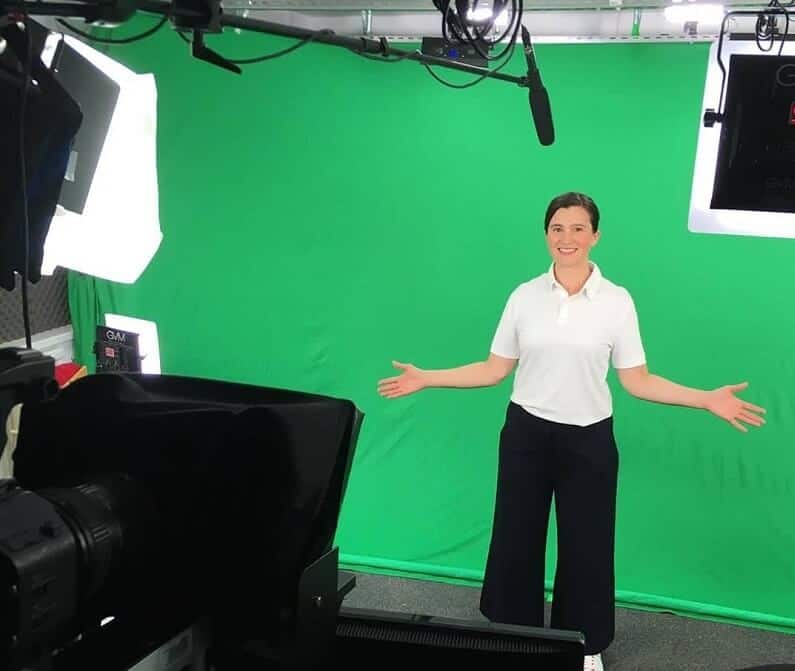 An image of myself in front of studio cameras, in front of a green screen