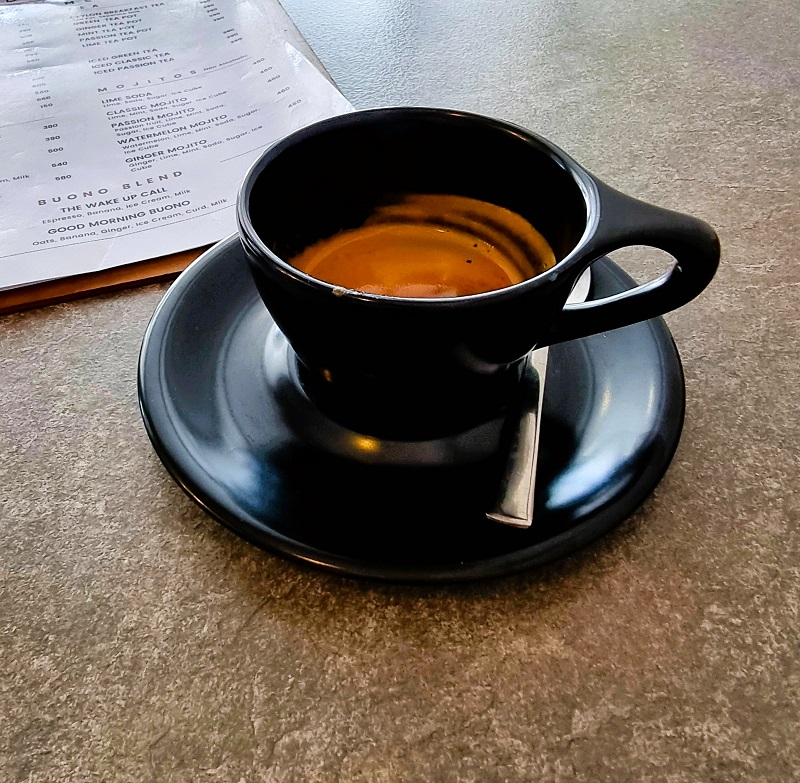 a black cup with coffee 