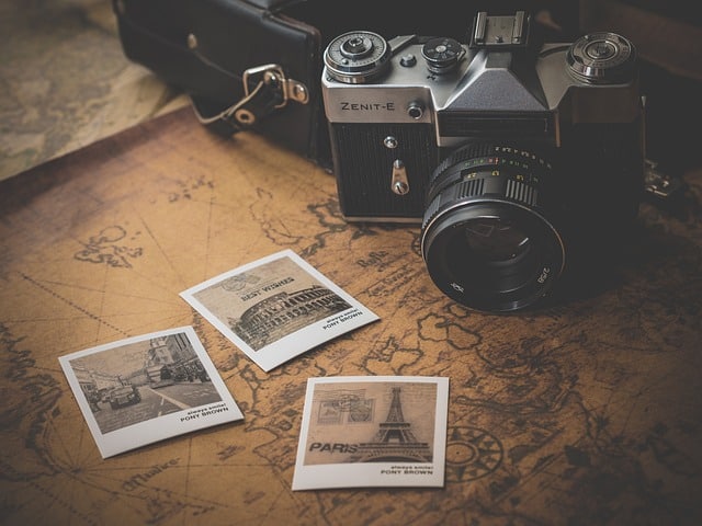 A DCR camera on a map with black and white photographs