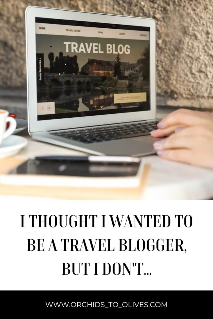 A laptop with the title Travel Blog on the screen. Text Reads I thought I wanted to be a Travel Blogger, but I don't....